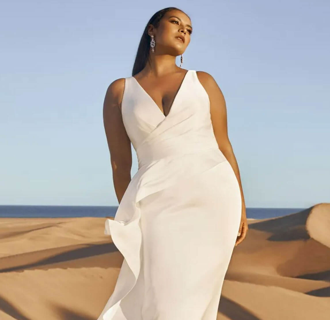 Model wearing a white gown by Pronovias