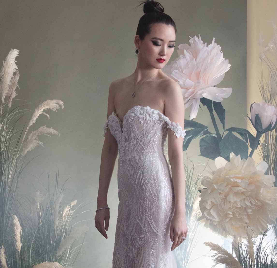 Model wearing a white gown by Badgley Mischka