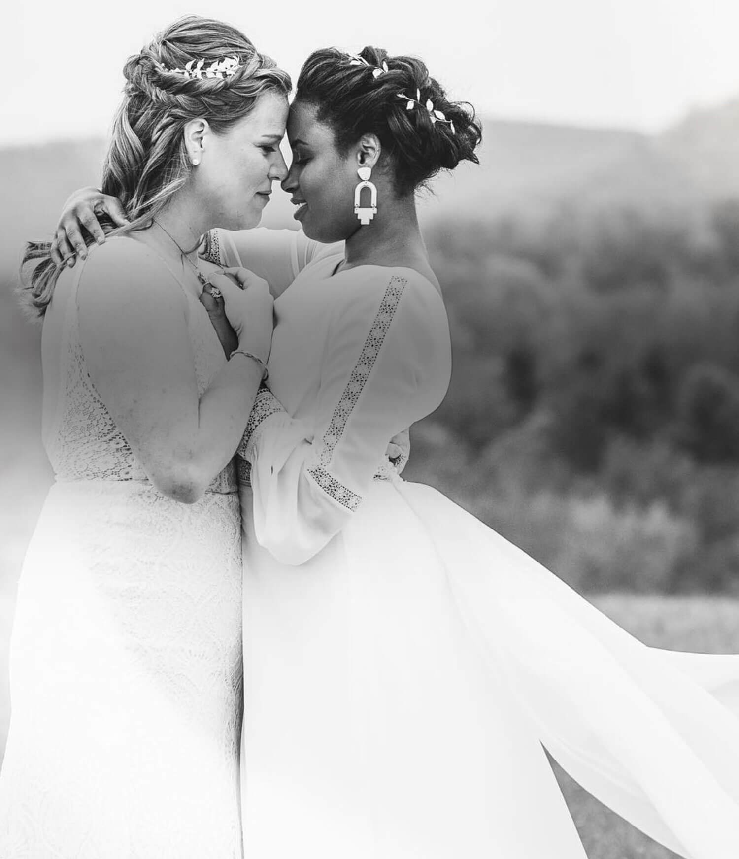 Models wearing a white dresses. Mobile image