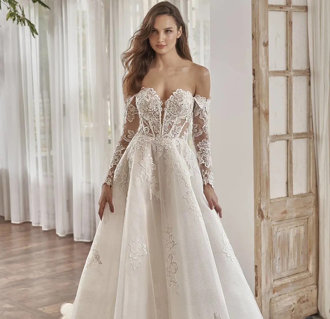 Model wearing a white gown by Pen Liv