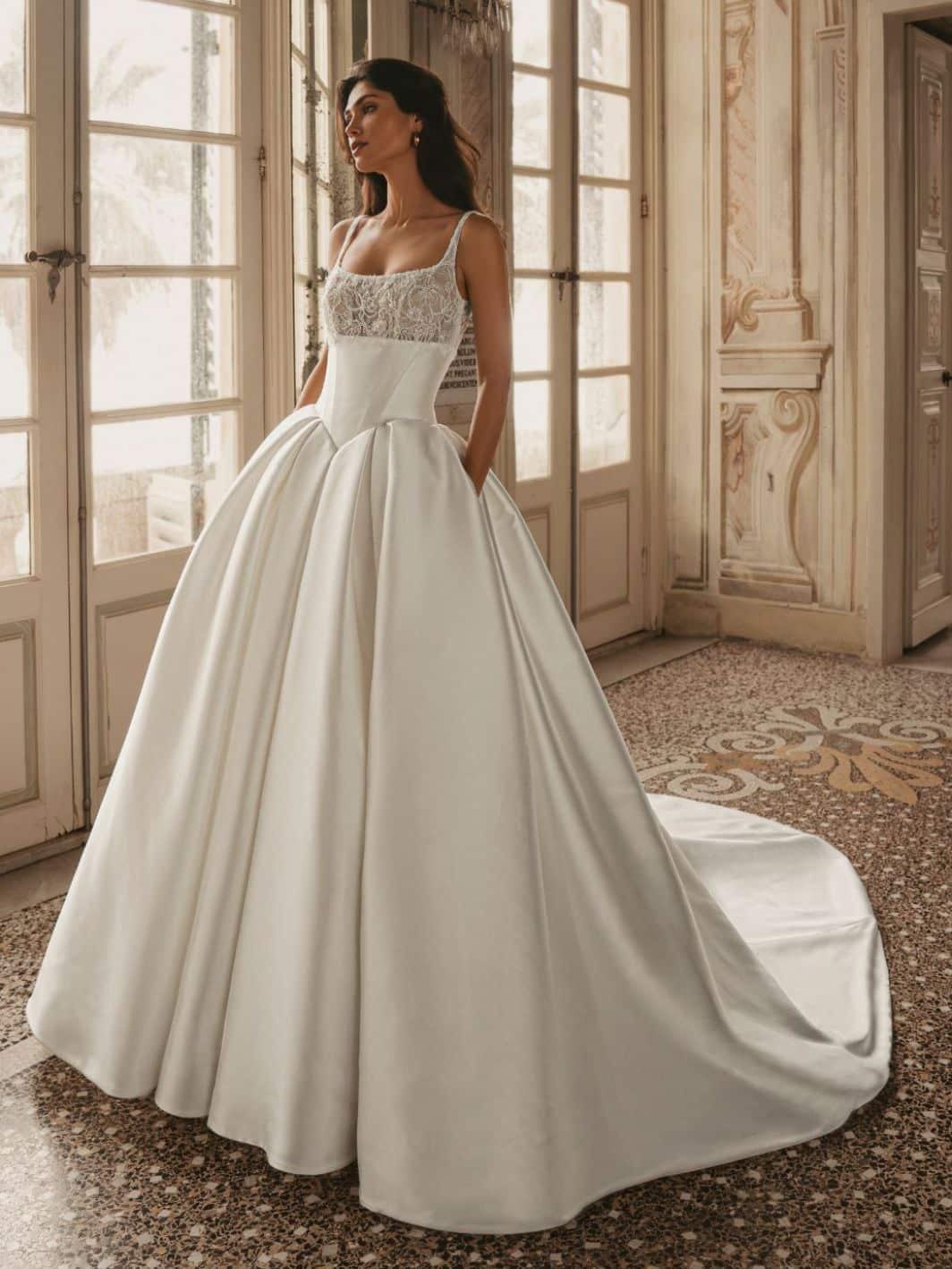 Model wearing a white gown by Enzoani