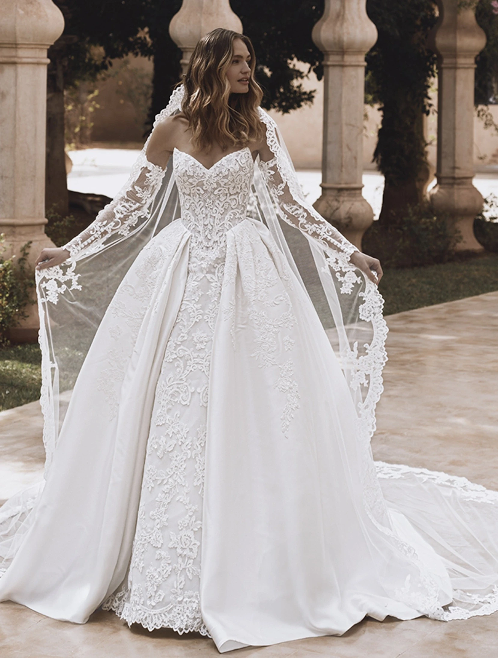 Model wearing a white gown by Enzoani