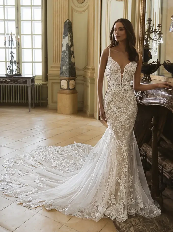 Model wearing a white gown by Elysee