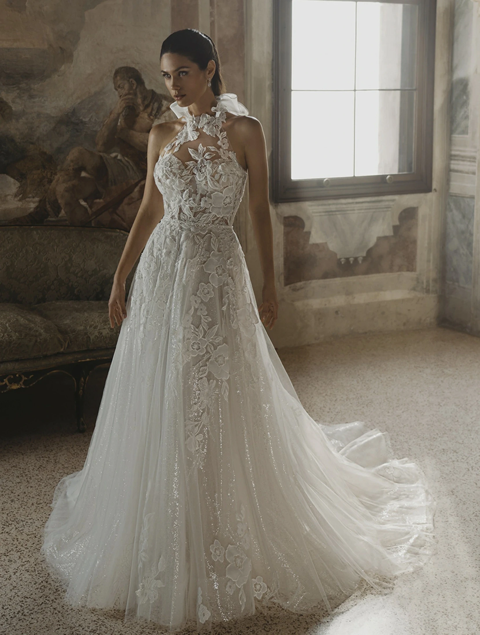Model wearing a white gown by Pen Liv
