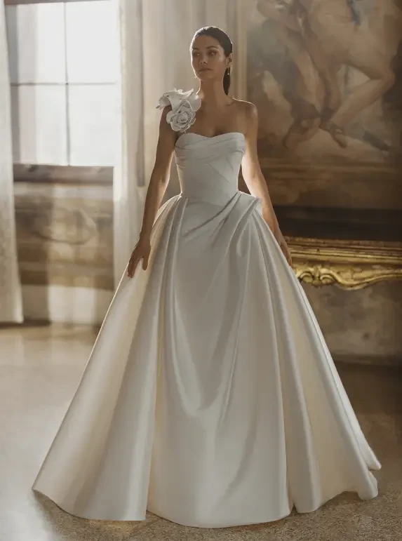 Model wearing a white gown by Pen Liv