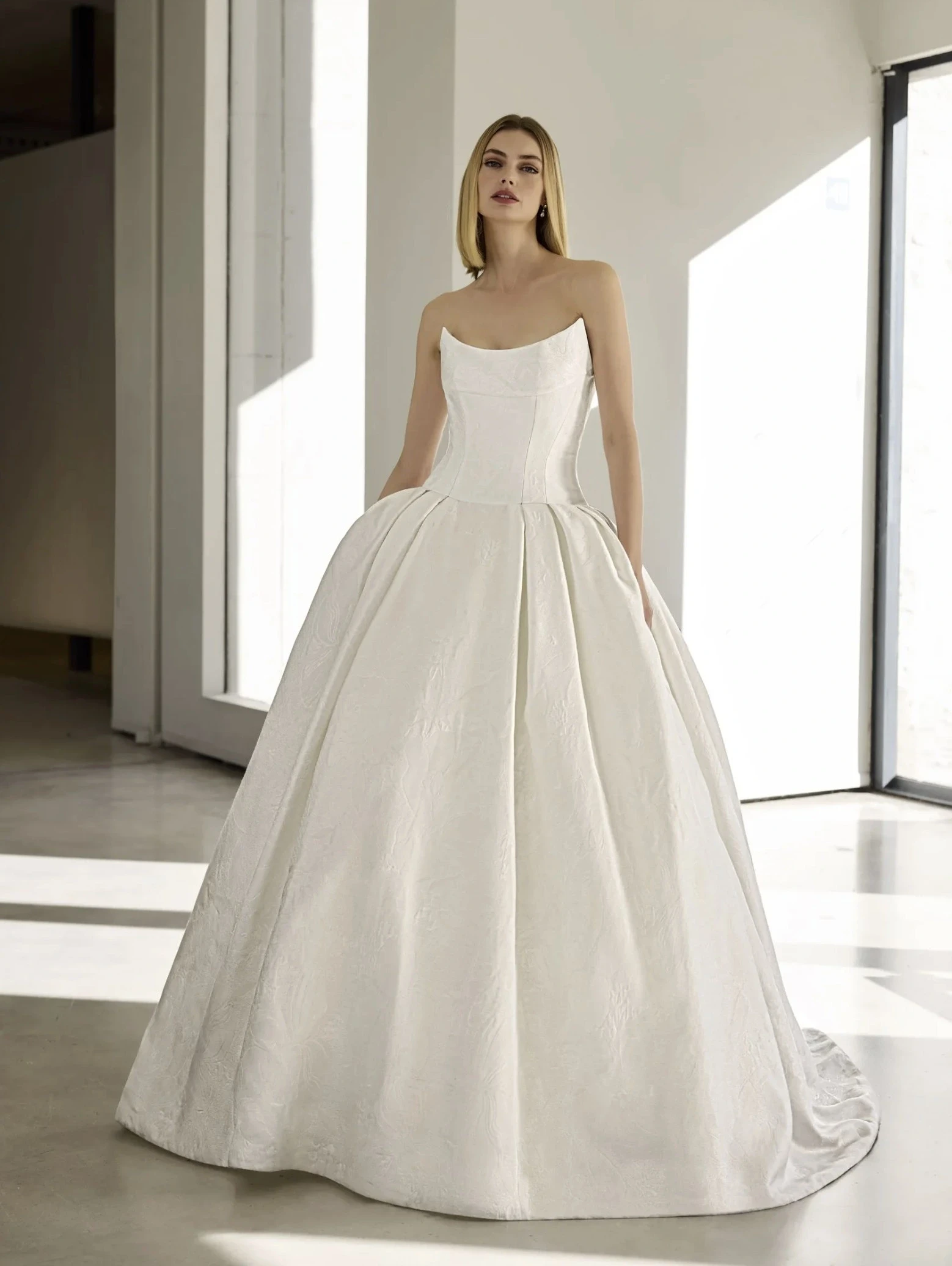 Model wearing a white gown by Pronovias