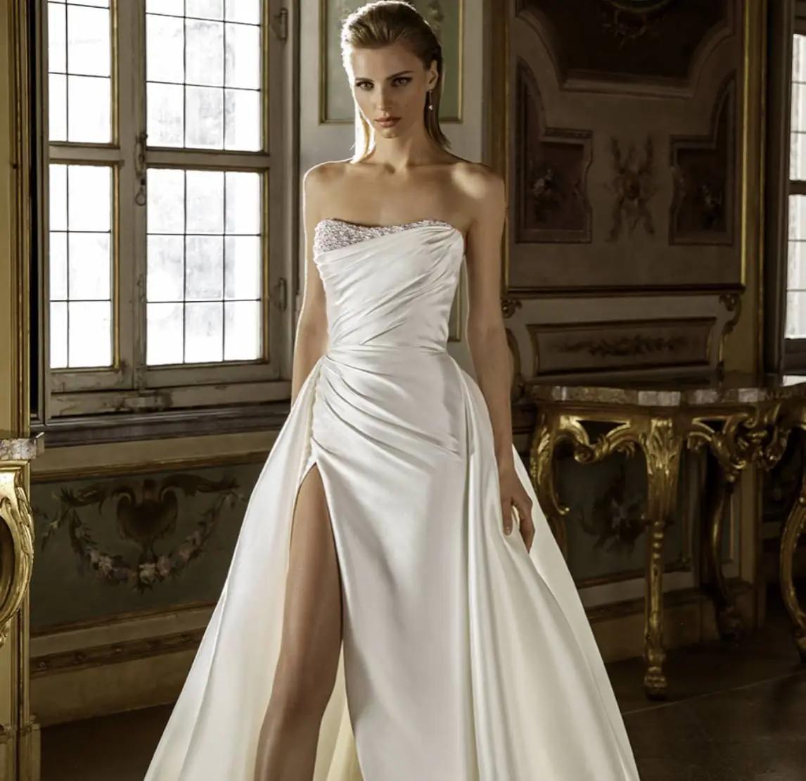 Model wearing a white gown by Pen Liv