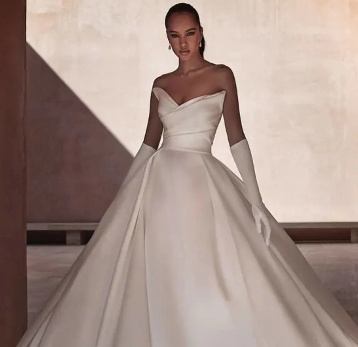 Model wearing a white gown by Pronovias