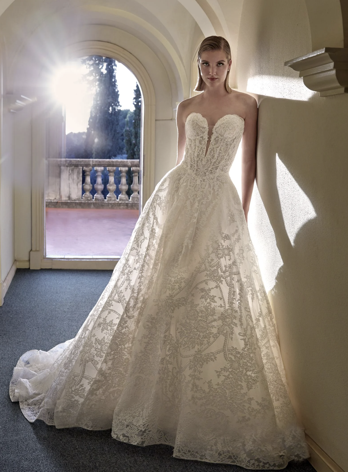 Model wearing a white gown by Pronovias